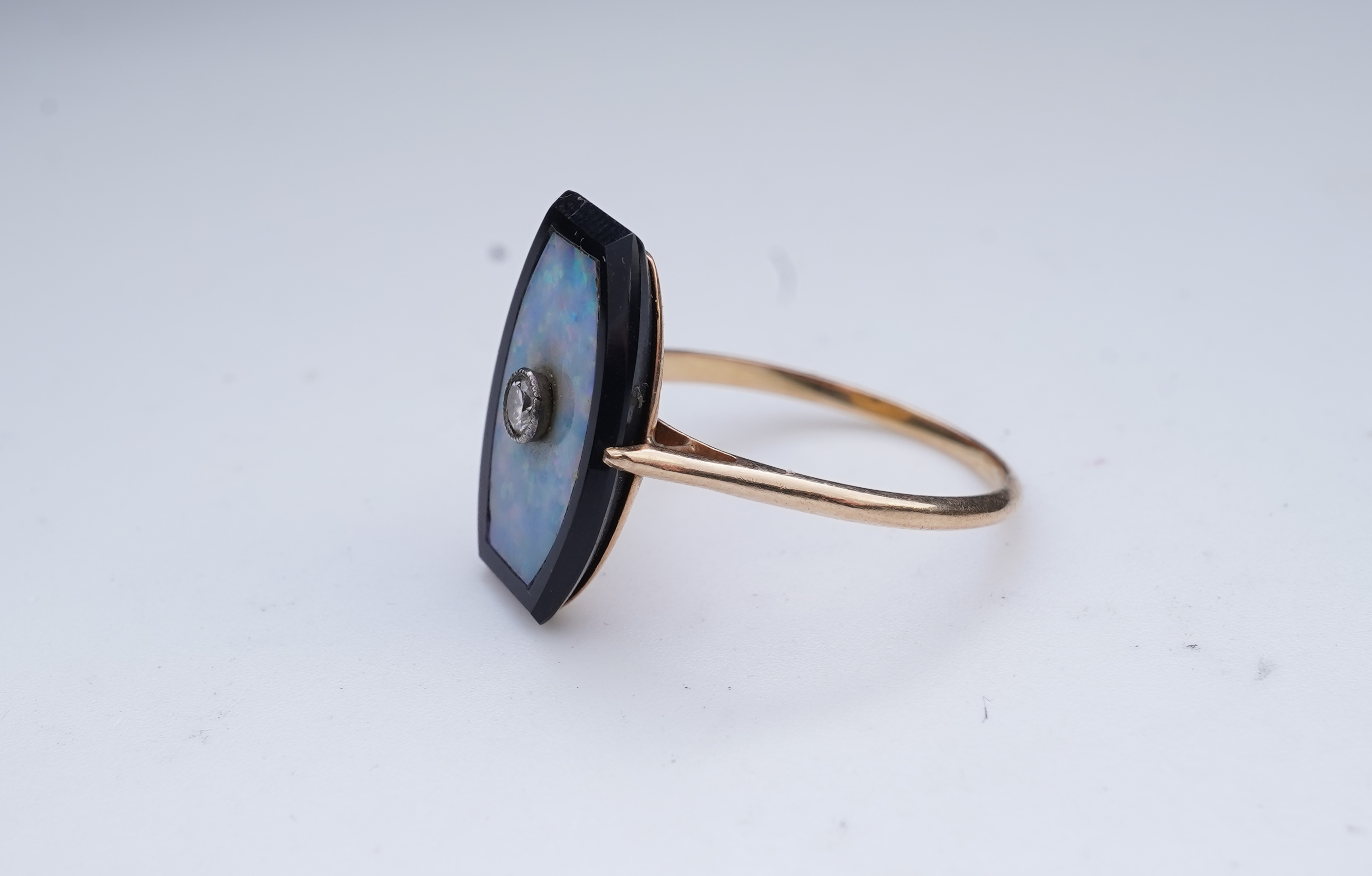 An opal, onyx and diamond ring, early 20th century composite